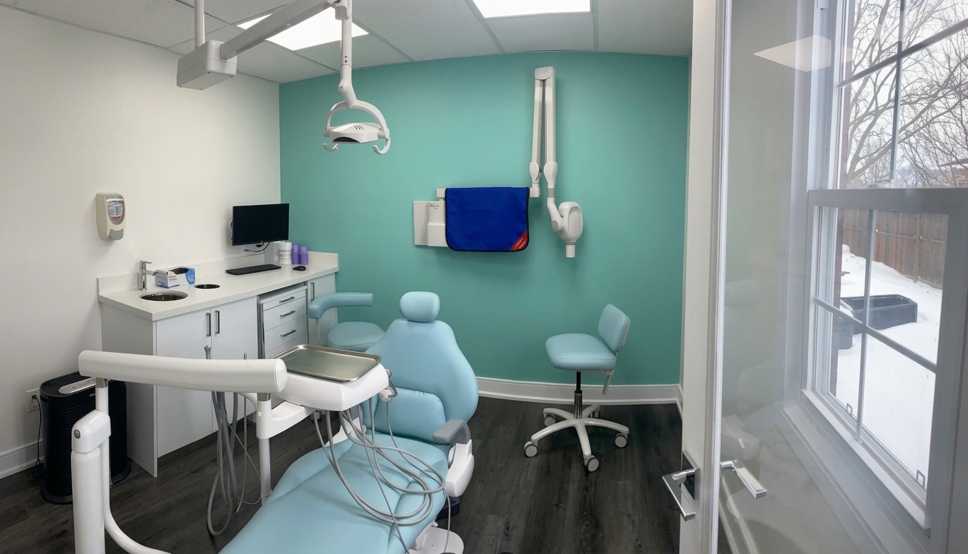 Bright treatment room with a pale blue dental chair